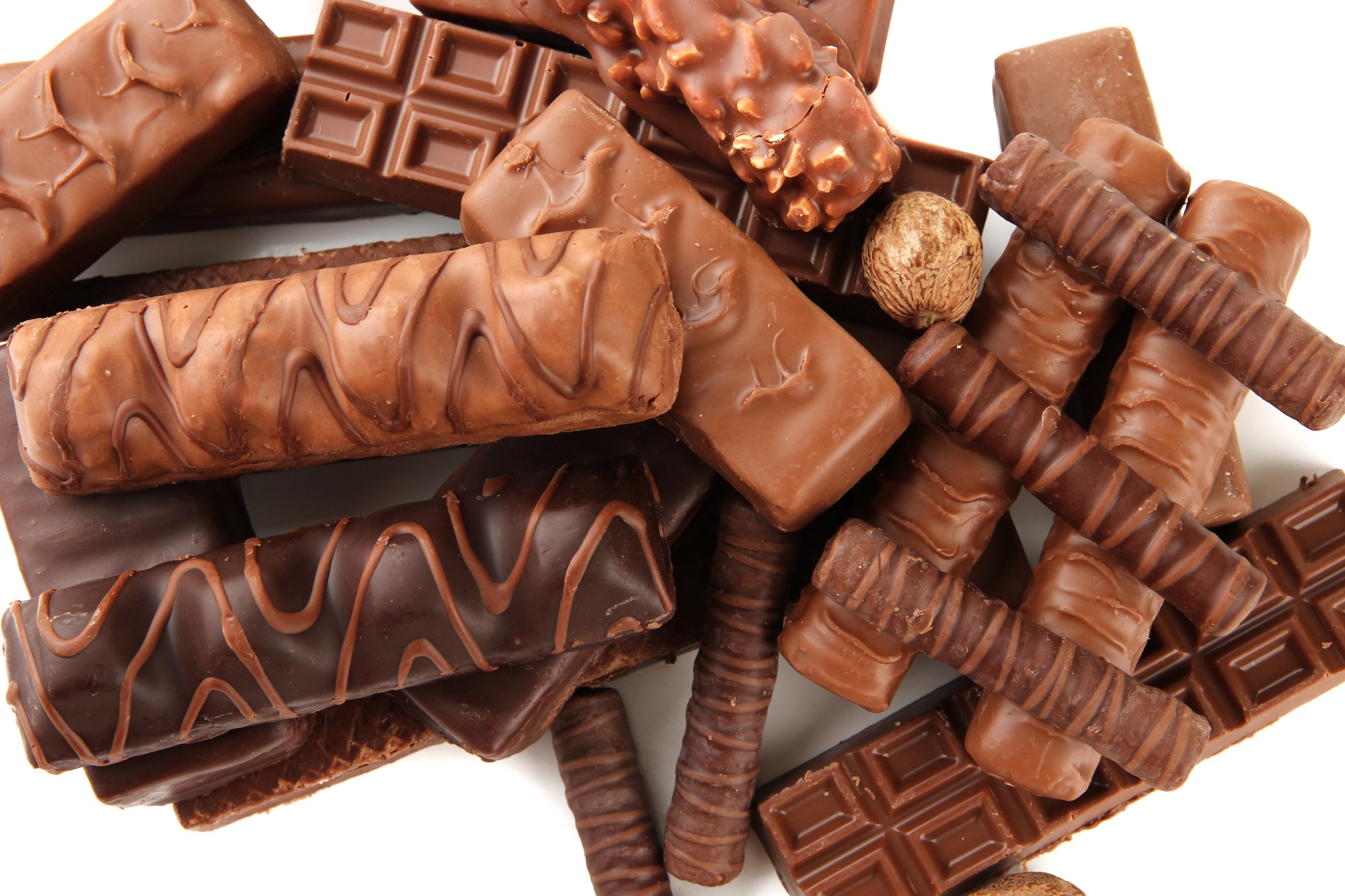 Delicious chocolate bars with nuts close up